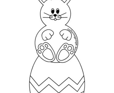 rabbit sitting on egg