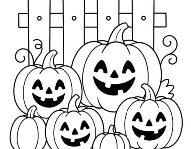 pumpkins next to a fence